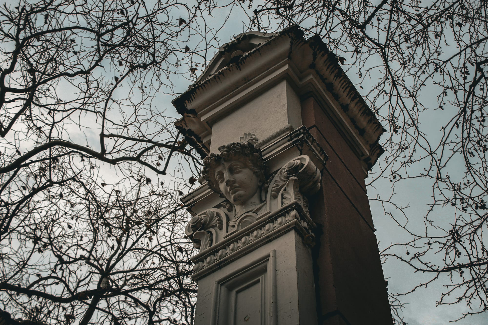 Ornate architectural column with cherub